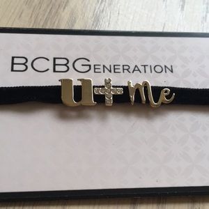 BCBG gold on a black velvet choker necklace